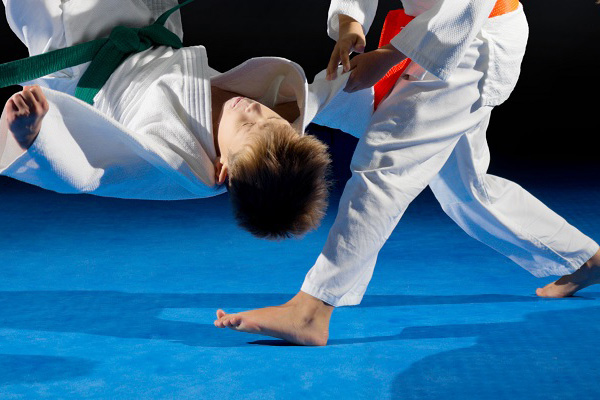 judo on blue foam gymnastic mat